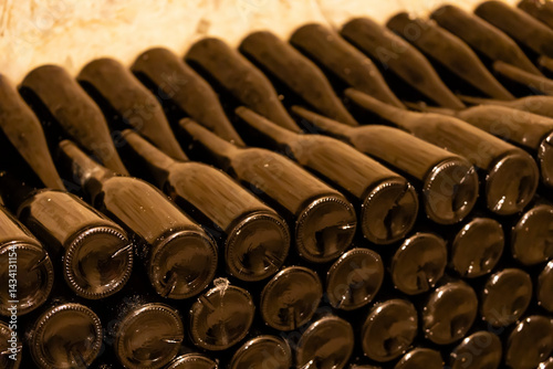 Obraz na płótnie Wine bottles aging in cellar, stacked and waiting for perfect moment w salonie
