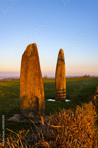 Obraz na płótnie Menhirs of Couches glowing during sunset in Saone et Loire, Bourgogne Franche Comte, France w salonie