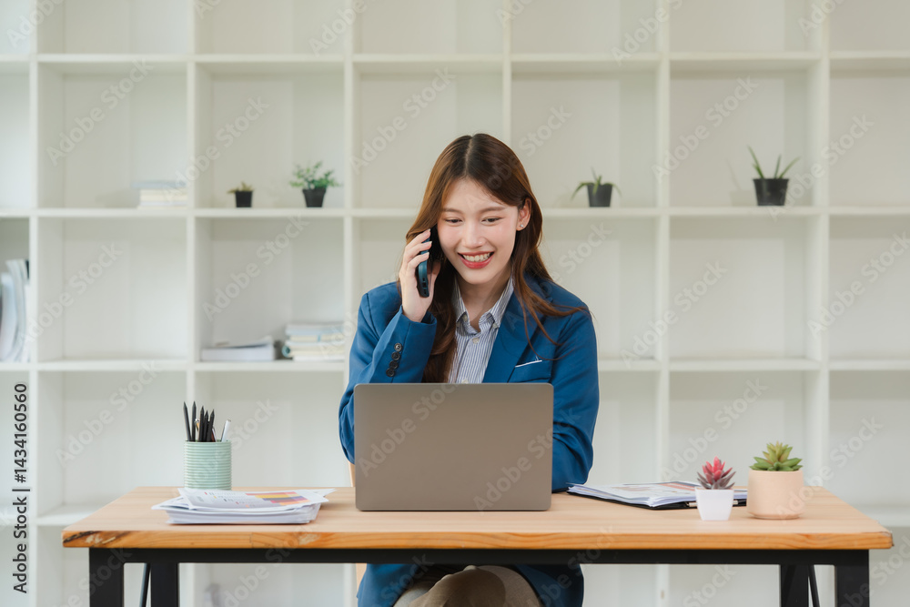 Smiling Businesswoman Talking on Phone at Desk Smiling Businesswoman Talking on Phone at Desk