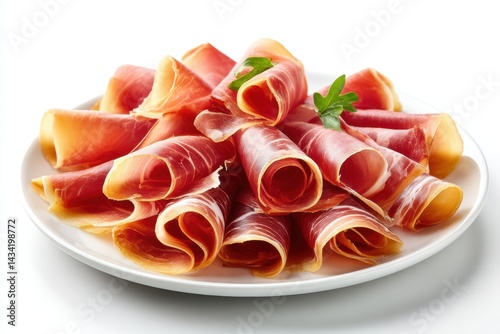 Thinly sliced prosciutto elegantly arranged on a white plate for a culinary presentation or gourmet dining experience