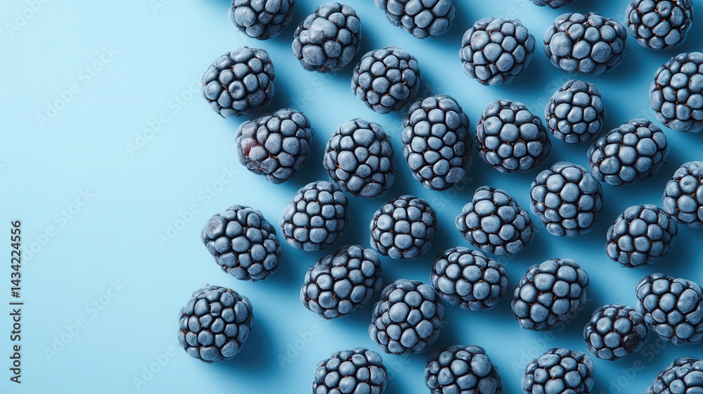 Geometric arrangement of blackberries on a pastel background showcasing clean and modern lighting Geometric arrangement of blackberries on a pastel background showcasing clean and modern lighting