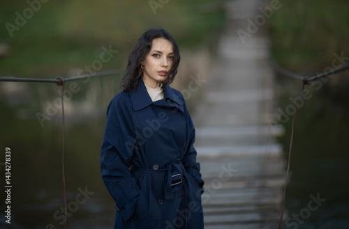 Obraz na płótnie Portrait of a beautiful Asian woman with long black hair and wearing blue coat. w salonie