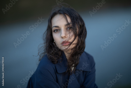 Obraz na płótnie Portrait of a beautiful Asian woman with long black hair and wearing blue coat. w salonie