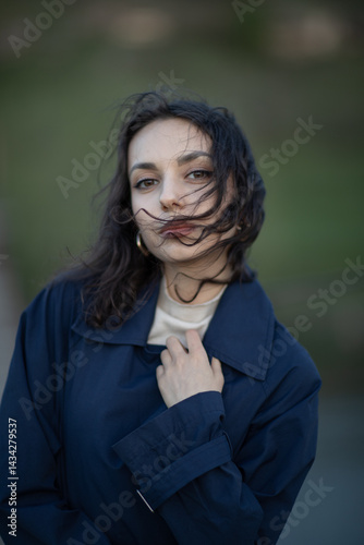 Obraz na płótnie Portrait of a beautiful Asian woman with long black hair and wearing blue coat. w salonie