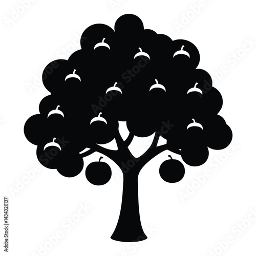 Silhouette of a fruit bearing tree heavy with apples on branches