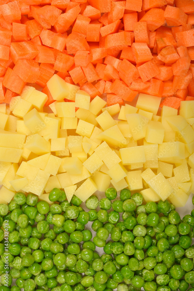 A top-down close-up shows neatly separated sections of green peas, diced potatoes, and diced carrots