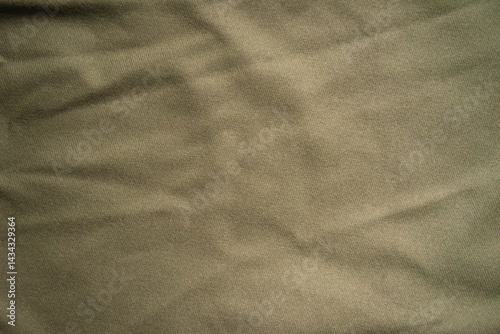 Knitted khaki fabric with a soft texture.Military background for the text.