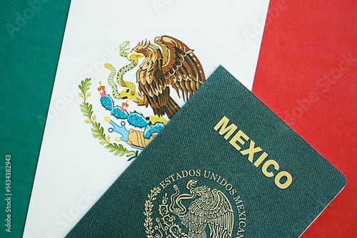 Mexican passport lies on Mexico flag close up. Travel and citizenship