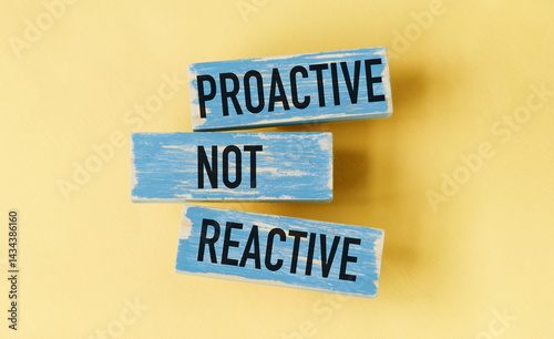 Canvastavla Three wooden blocks with the words proactive, not reactive written on them