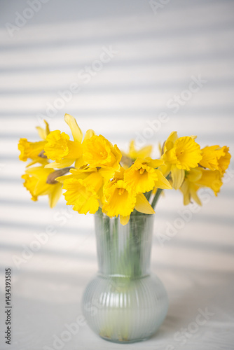 Wallpaper Mural daffodil flowers stand on the table in a vase Torontodigital.ca