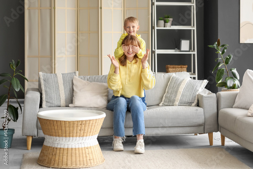 Happy little son closing hi...