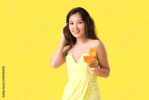 Young Asian woman with aper...