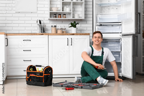 Happy male worker of repair...