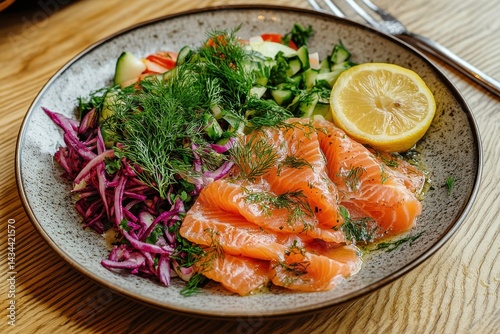 Smoked trout fillet served with dill lemon and vegetable salad on a plate Rustic wooden background photo
