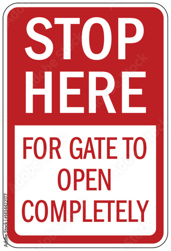 Stop sign stop here for gate to open completely