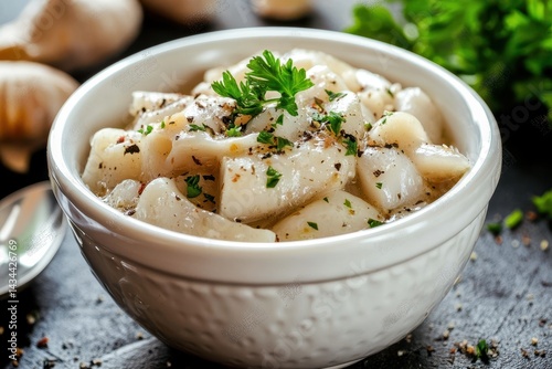 Tasty pickled herring in a white bowl a healthy fat option