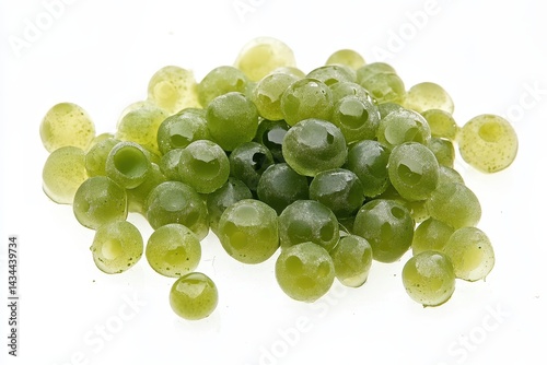 Wolffia globosa also known as swamp algae or water meal is a freshwater alga referred to as green caviar on a white background photo