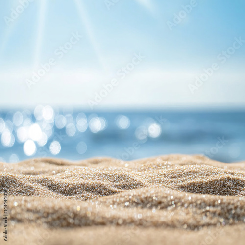 Obraz na płótnie Background with sand in the foreground and sky in the background. summer beach nature with rays of sunlight. golden sand beach. sea water against blue sky with clouds w salonie