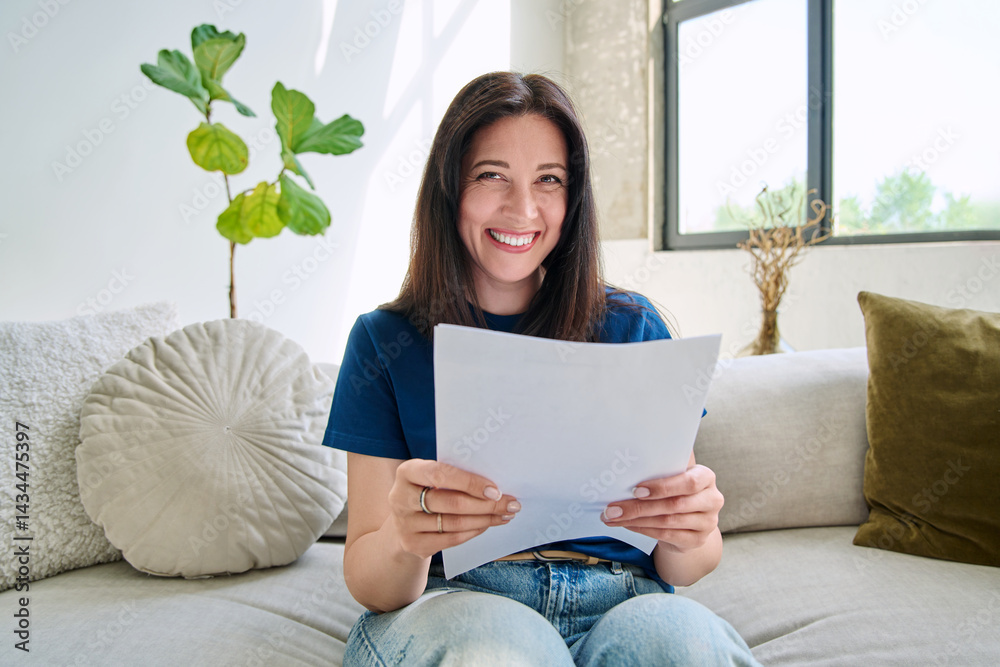 Webcam view young smiling woman with business papers having video