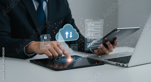 A man using a tablet with cloud computing and security icons displayed above the device surface area view selling, purchasing,$, agreement