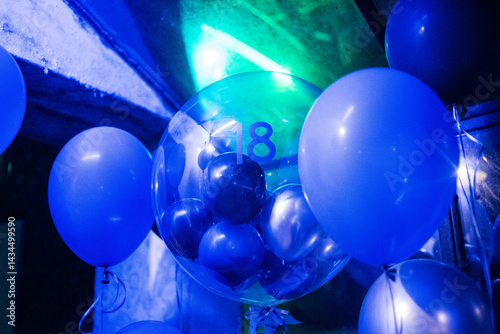 Celebration setup with blue balloons and lights