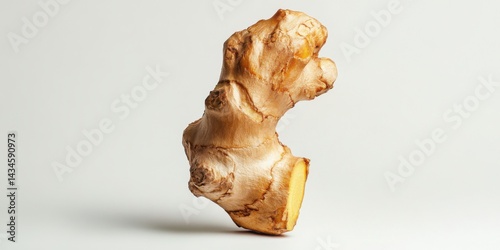 A piece of ginger root isolated on a white background photo