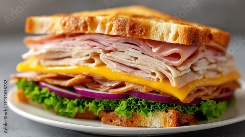 A mouthwatering classic club sandwich, brimming with layers of meat, cheese, and vibrant veggies on a crisp plate.