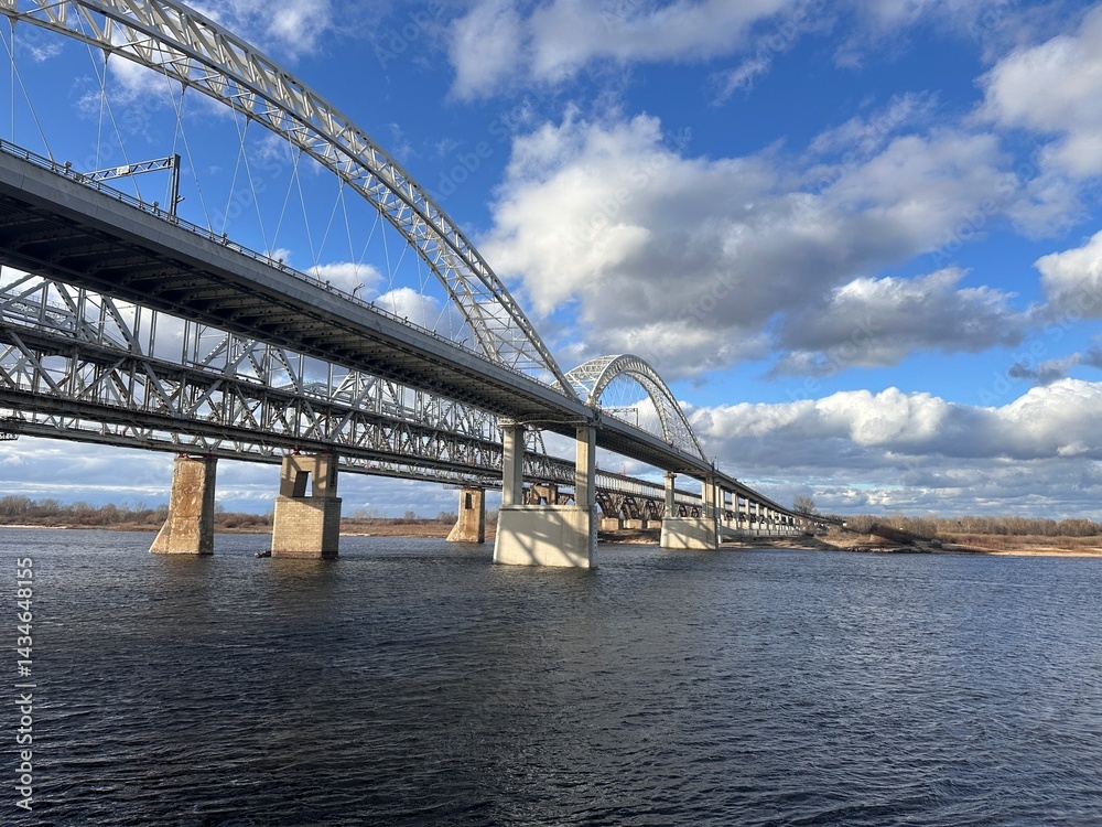 Obraz premium A bridge over a river with a train on it