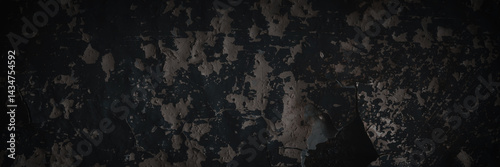 Obraz na płótnie Dark wide panoramic background. Peeling paint on a concrete wall. Dark grunge texture of old cracked flaking paint. Weathered rough painted surface. Patterns of cracks. Darkness background for design. w salonie