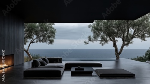 Modern outdoor living space with ocean view, featuring furniture and fireplace.