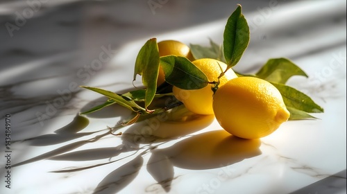 Obraz na płótnie Three fresh lemons with green leaves on marble, a vibrant citrus still life symbolizing freshness and natural beauty. w salonie