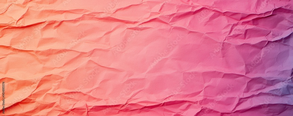 Fototapeta premium A vibrant, crumpled paper texture featuring gradients of pink and orange, creating a visually appealing backdrop.