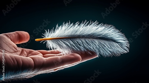 A delicate white feather resting on an outstretched hand against a dark background, symbolizing gentleness
