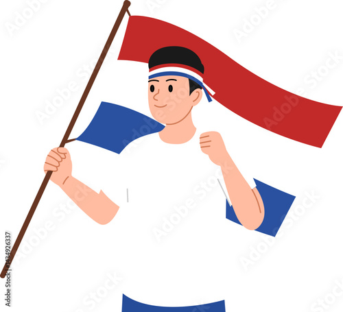 Young man holding the Netherlands flag 