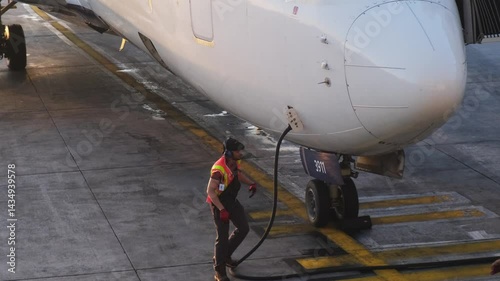 Refueling aircraft at the airport terminal, ensuring efficient operations and safety protocols