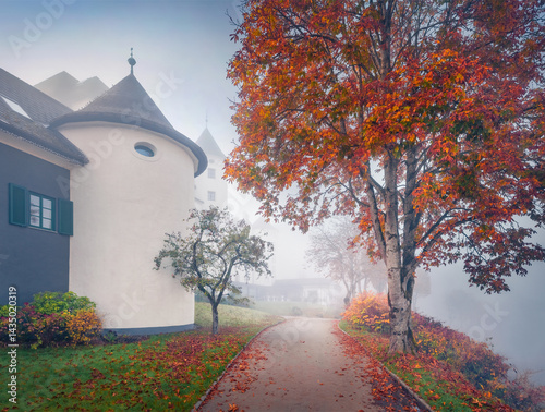 Obraz na płótnie Astonishing morning view of Pichlarn Castle, situated on an elevation in the Ennstal valley in Styria, at the foot of the Grimming mountain massif. Nice autumn cityscape of Pichlarn resort, Austria. w salonie
