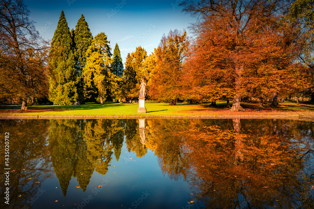Calm autumn scene of Hellbrunn castle garden, Austria, Europe. Picturesque morning view of Hellbrunn garden lake in outskirts of Salzburg city, Austria, Europe. Beauty of nature concept background..