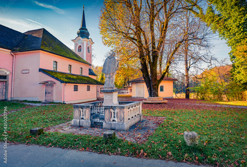 Wonderful morning view of Parish and pilgrimage church of St. James the Elder with old sculpture, Katastralgemeinde Thurnberg village, Austria, Europe. Amazing autumn scene of austrian countryside.