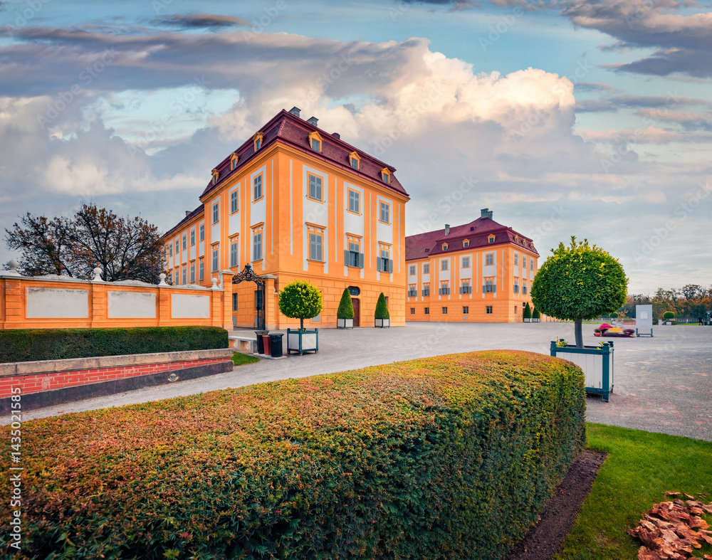 Colorful autumn view of Hof castle, 18th century Habsburg complex including a farm with restored state rooms and ornamental grounds. Astonishing afternoon scene of Schloshof park, Austria, Europe.