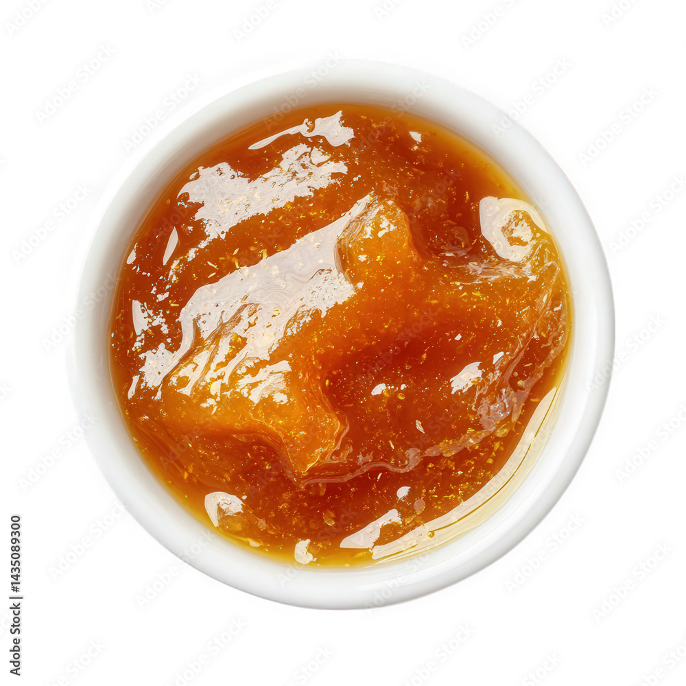 a small white bowl filled with a shiny. amber-colored jam or jelly. likely made from fruit the texture appears smooth and glossy. suggesting it could be used as a spread or a topping for various dishe