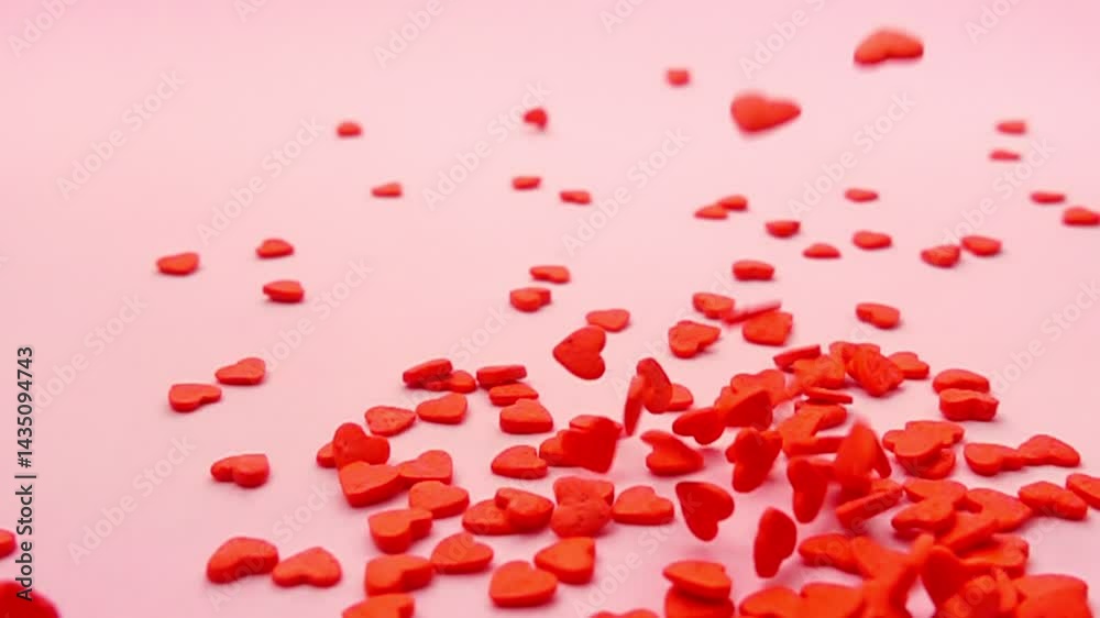 mesmerizing display of heart shaped sprinkles dancing on soft pink background, evoking feelings of love and happiness in fun and artistic manner, concept St Valentine day, copy space