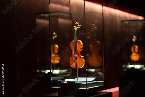 Violinmaking historical masterpieces on Display in Treasure box room in violin museum Cremona, Italy