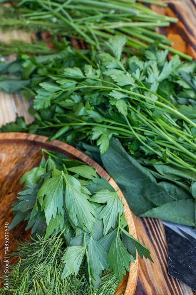 fresh greens from the garden, prepared for summer salad in the country.