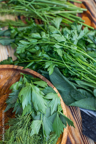 Obraz na płótnie fresh greens from the garden, prepared for summer salad in the country. w salonie