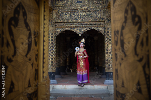 Obraz na płótnie Beautiful young woman wearing Thai Songkran costume, a regional Thai costume dress in Chiang Mai, Thailand. w salonie