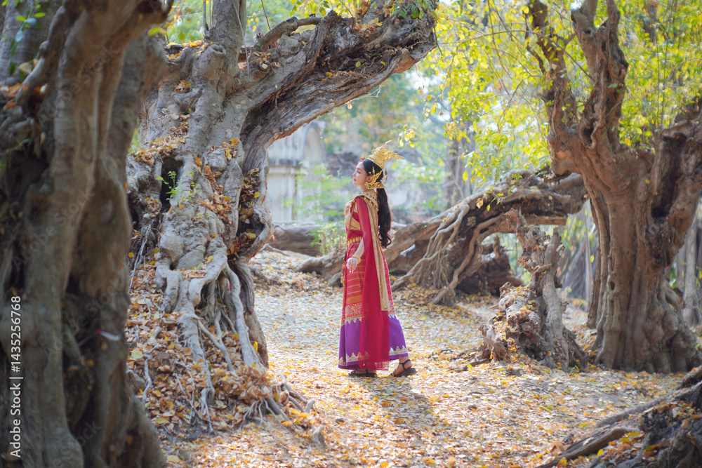 Beautiful young woman wearing Thai Songkran costume, a regional Thai costume dress in Chiang Mai, Thailand.