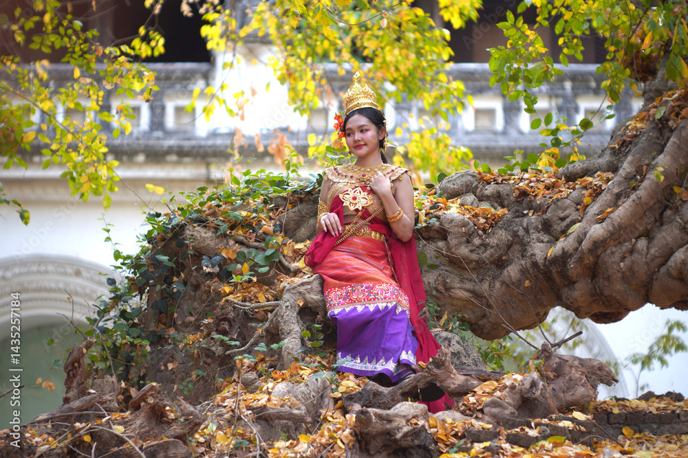 Beautiful young woman wearing Thai Songkran costume, a regional Thai costume dress in Chiang Mai, Thailand.