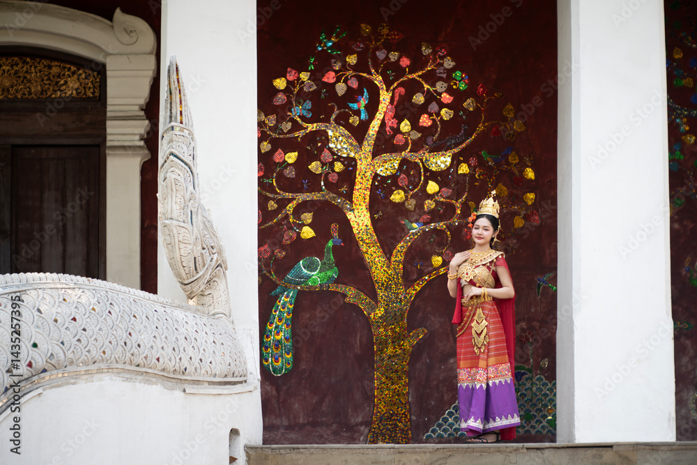 Beautiful young woman wearing Thai Songkran costume, a regional Thai costume dress in Chiang Mai, Thailand.
