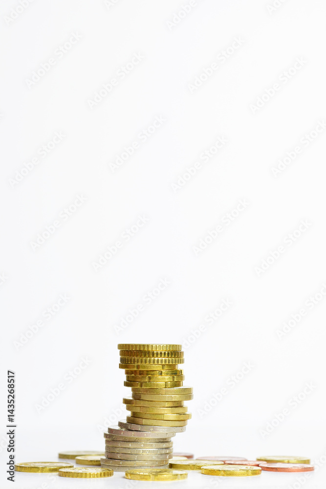 Stacked euro coins, light background. Vertical shot. Stacked euro coins, light background. Vertical shot.
