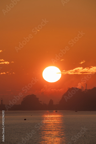 a picture of the sunrise and the island
